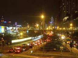 Kowloon with the Former Kowloon-Canton Railway Clock Tower, with a view on the skyline of Hong Kong with the Bank of China Tower, by night