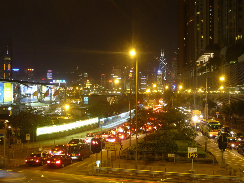 Kowloon with the Former Kowloon-Canton Railway Clock Tower, with a view on the skyline of Hong Kong with the Bank of China Tower, by night