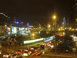 Kowloon with the Former Kowloon-Canton Railway Clock Tower, with a view on the skyline of Hong Kong with the Bank of China Tower, by night