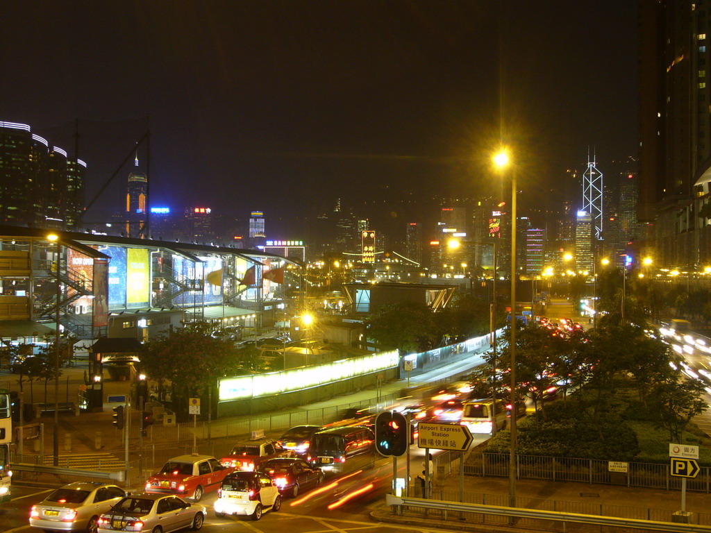 Kowloon with the Former Kowloon-Canton Railway Clock Tower, with a view on the skyline of Hong Kong with the Bank of China Tower, by night