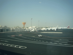 Airplanes and buildings at Doha International Airport, viewed from the Departure Hall