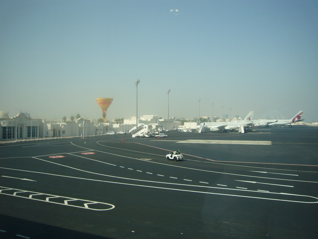 Airplanes and buildings at Doha International Airport, viewed from the Departure Hall