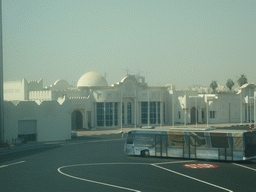 Bus and buildings at Doha International Airport, viewed from the Departure Hall
