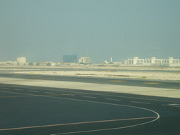 Runway and buildings close to Doha International Airport, viewed from the Departure Hall