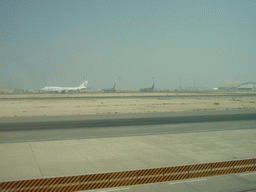 Runway and airplanes at Doha International Airport, viewed from the Departure Hall