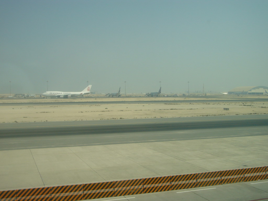 Runway and airplanes at Doha International Airport, viewed from the Departure Hall