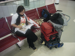 Miaomiao with our suitcases at the Departure Hall of Doha International Airport