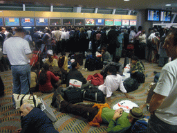 Stranded travellers at the transfer desks of Dubai International Airport