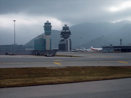 Hills, control towers and airplanes at Hong Kong International Airport, viewed from the airplane from Haikou
