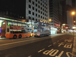 Tram in front of the Hong Kong Trade Centre at the Des Voeux Road, by night