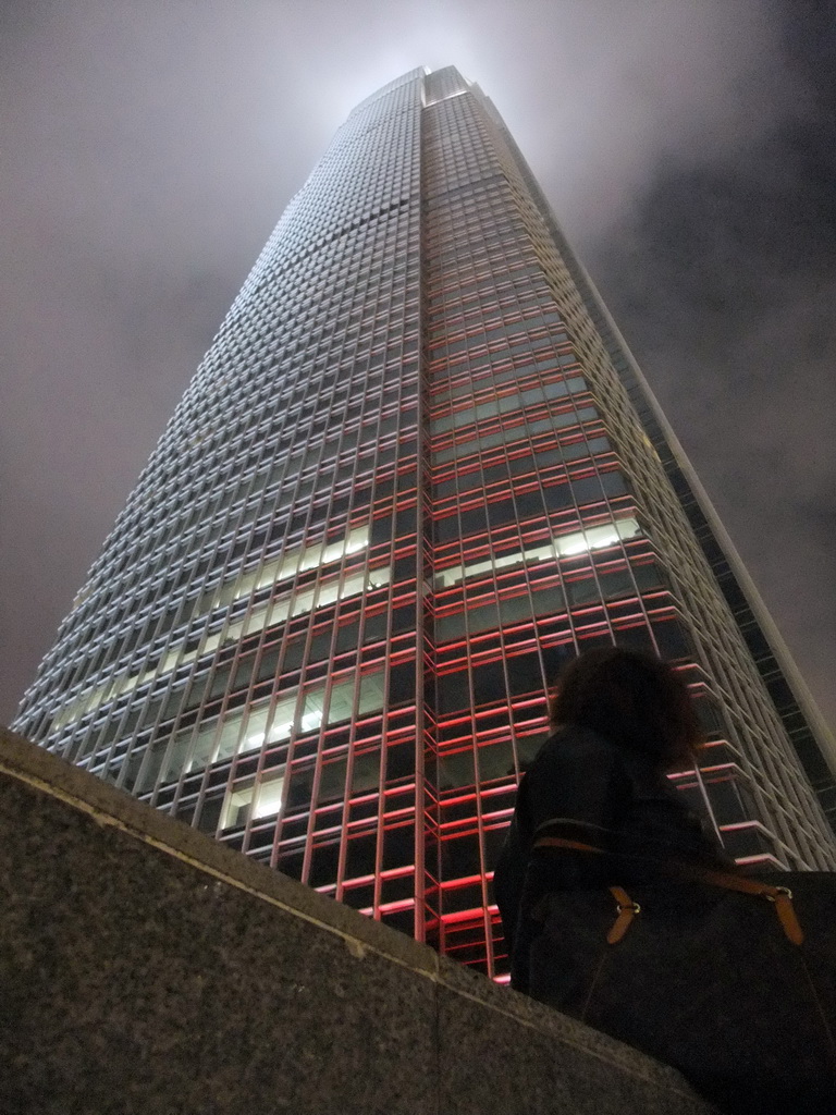 Miaomiao and the Two International Finance Centre building, viewed from the roof terrace of the IFC Mall, by night