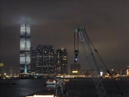 Victoria Harbour and the skyline of Kowloon with the International Commerce Centre, viewed from the roof terrace of the IFC Mall, by night