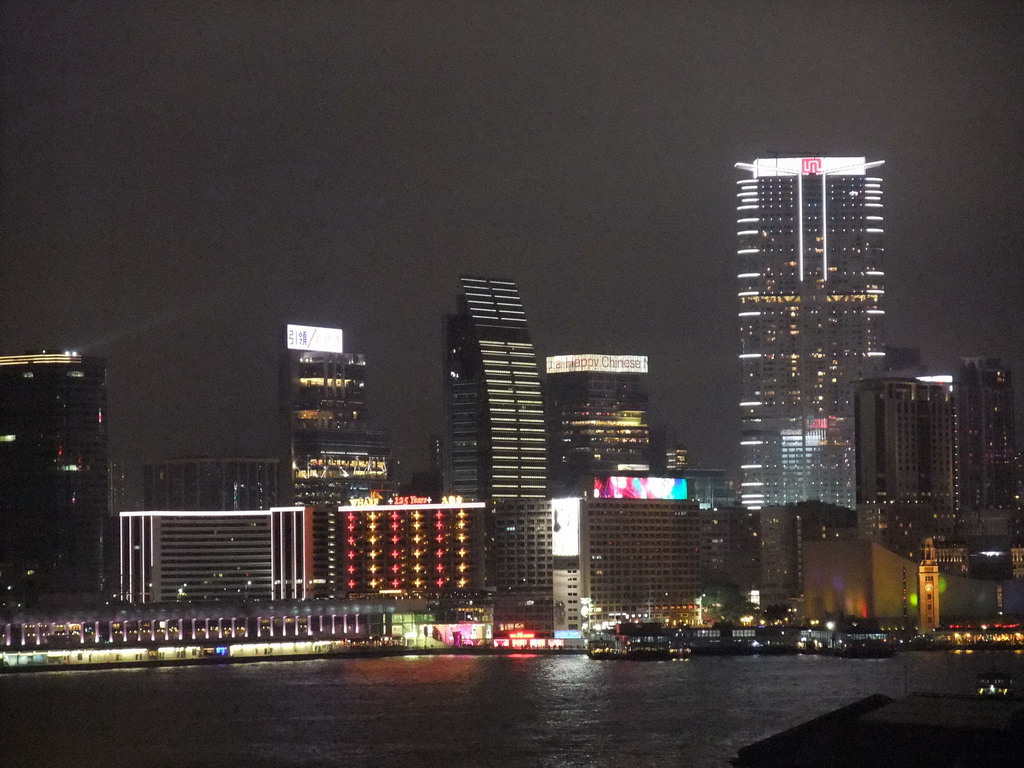 Victoria Harbour and the skyline of Kowloon, viewed from the roof terrace of the IFC Mall, by night