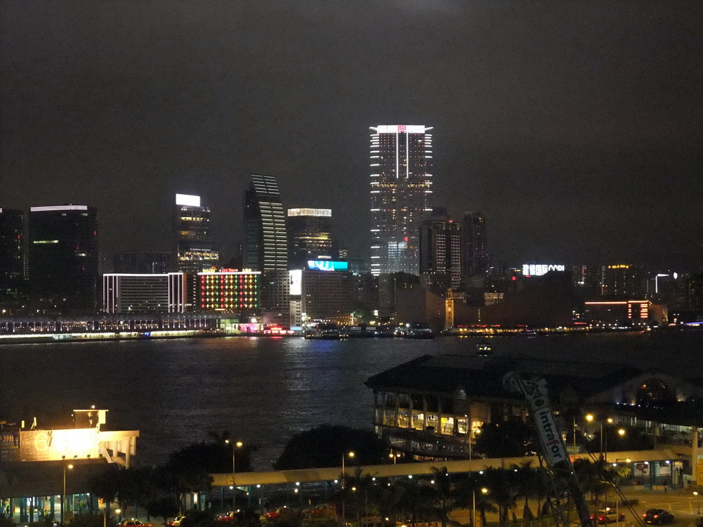 Victoria Harbour with the Star Ferry Pier and the skyline of Kowloon, viewed from the roof terrace of the IFC Mall, by night