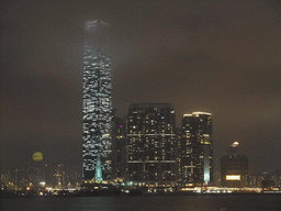 Victoria Harbour and the skyline of Kowloon with the International Commerce Centre, viewed from the roof terrace of the IFC Mall, by night