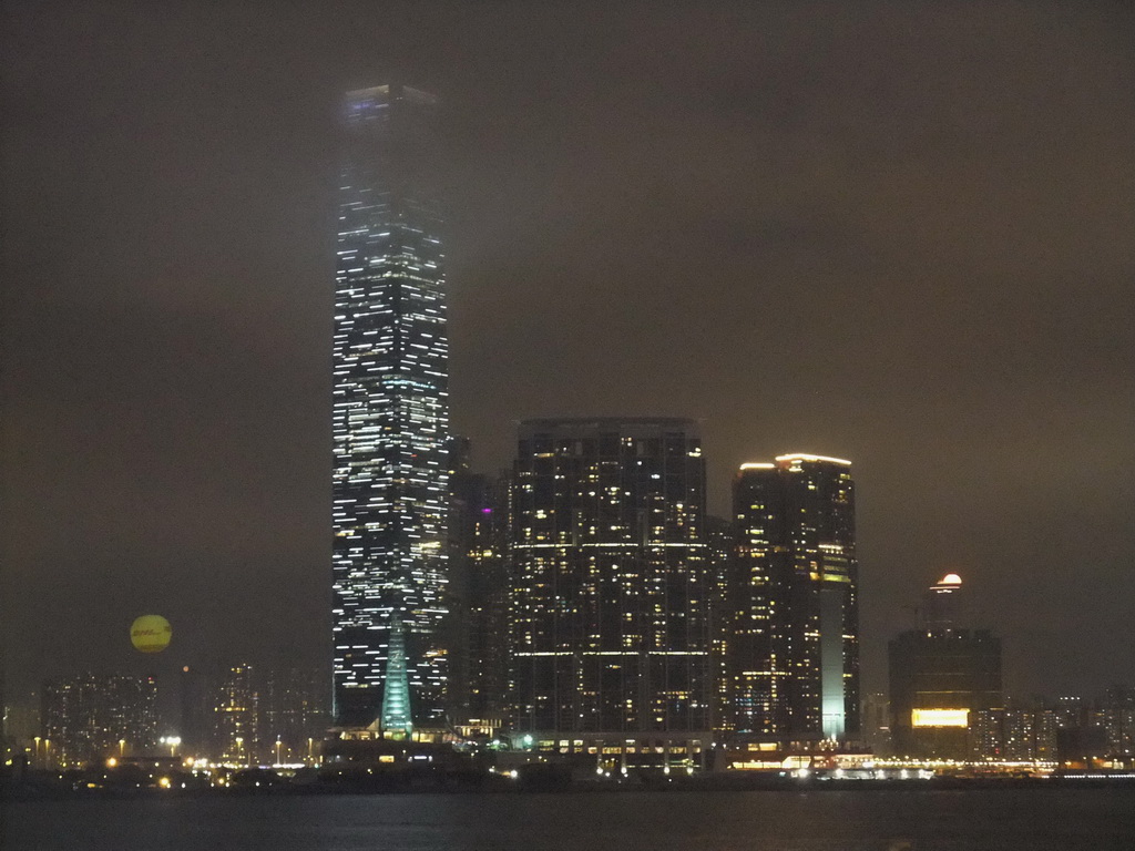 Victoria Harbour and the skyline of Kowloon with the International Commerce Centre, viewed from the roof terrace of the IFC Mall, by night