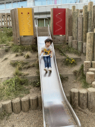 Max on the slide at the playground at the back side of the Vayamundo Houffalize hotel