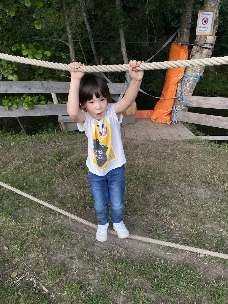 Max on a rope bridge at the back side of the Vayamundo Houffalize hotel