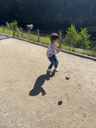 Max playing petanque at the back side of the Vayamundo Houffalize hotel