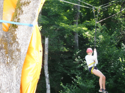 Child on a zip line at the back side of the Vayamundo Houffalize hotel