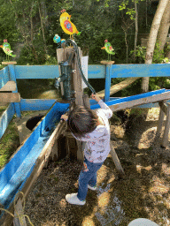 Max playing at the water playground at the back side of the Vayamundo Houffalize hotel