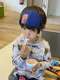 Max having an ice cream at the lobby of the Houtopia recreation center