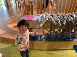 Max with listening tubes at the sensory room of the Houtopia recreation center