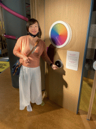 Miaomiao with a Newton disc at the sensory room of the Houtopia recreation center