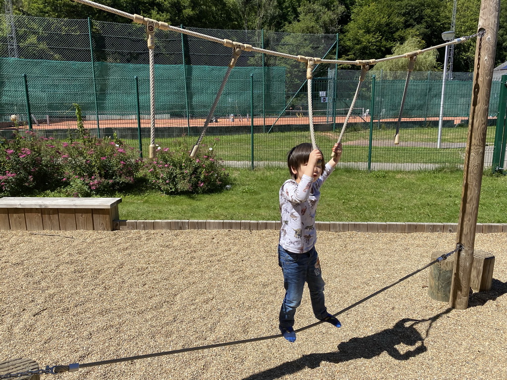 Max on a rope bridge at the playground of the Houtopia recreation center