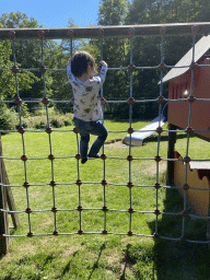 Max on a climbing net at the playground of the Houtopia recreation center