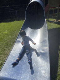 Max on a slide at the playground of the Houtopia recreation center