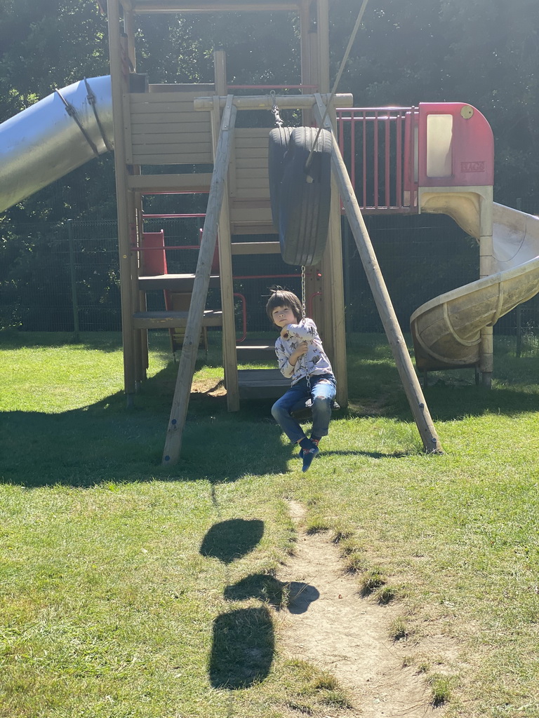 Max on a zip line at the playground of the Houtopia recreation center