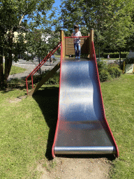 Max on a slide at the playground of the Houtopia recreation center