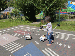 Max playing with small cars at the playground of the Houtopia recreation center