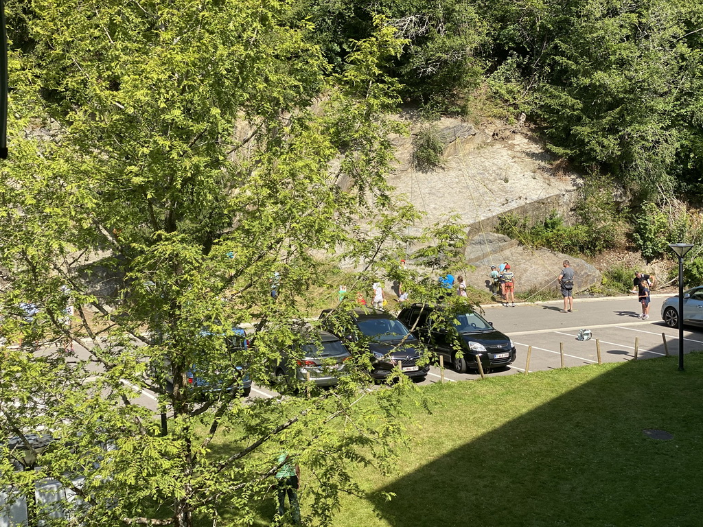 People climbing a wall at the front of the Vayamundo Houffalize hotel, viewed from the balcony of our room