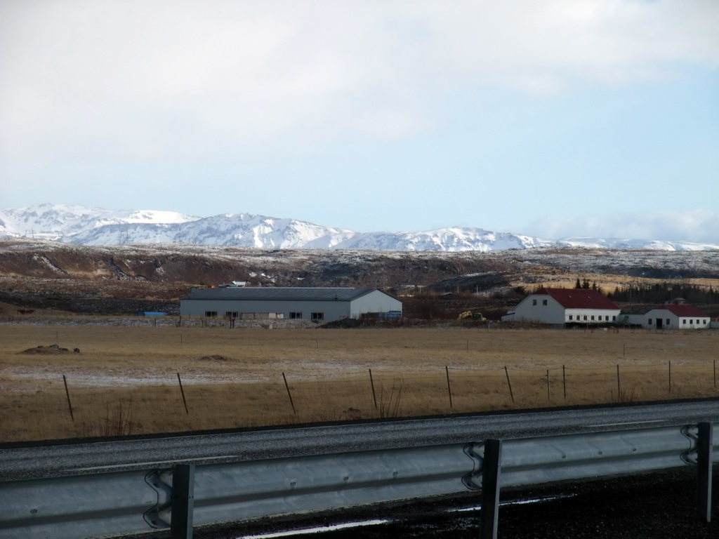 Mountains and houses west of Hveragerthi, viewed from a parking place alongside the Suðurlandsvegur road
