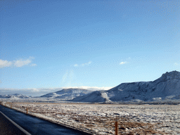 The Suðurlandsvegur road and mountains west of Hveragerthi, viewed from the rental car