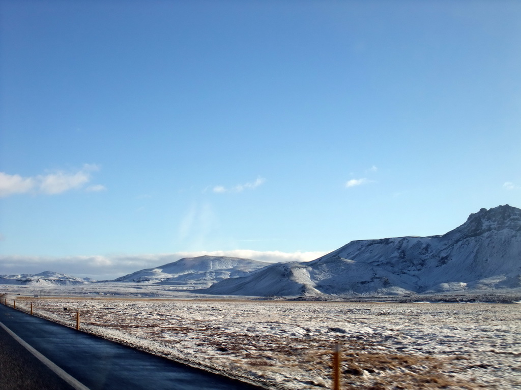 The Suðurlandsvegur road and mountains west of Hveragerthi, viewed from the rental car