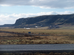 The Suðurlandsvegur road and mountains and geysers west of Hveragerthi, viewed from a parking place in Hveragerthi