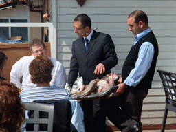 Waiters with fish plate at Beyaz Restaurant