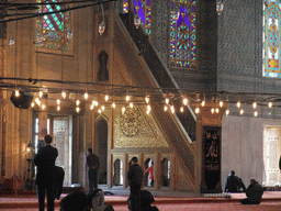 Minbar and praying muslims in the Blue Mosque