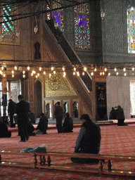 Minbar and praying muslims in the Blue Mosque