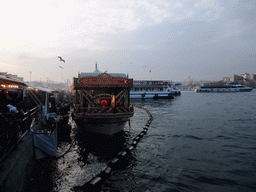 Fish boat restaurant and boats in the Golden Horn bay