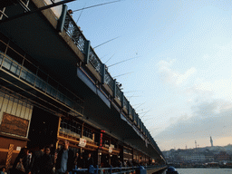 Fishermen on the Galata Bridge over the Golden Horn bay