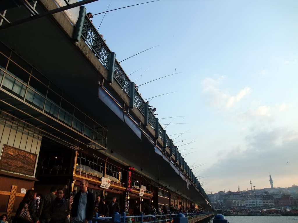 Fishermen on the Galata Bridge over the Golden Horn bay