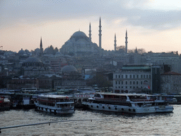 The Rüstem Pasha Mosque, the Süleymaniye Mosque and boats in the Golden Horn bay, viewed from the Galata Bridge