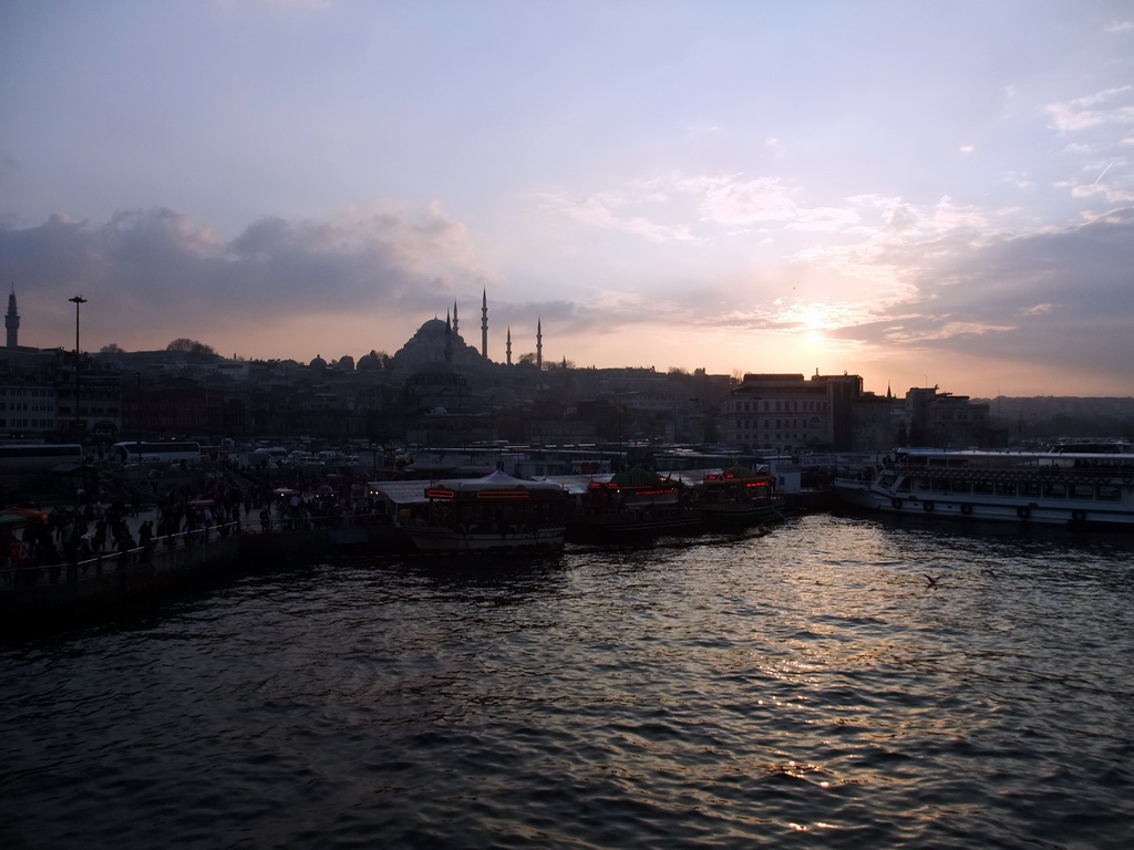 The Rüstem Pasha Mosque, the Süleymaniye Mosque and fish boat restaurants in the Golden Horn bay, viewed from the Galata Bridge