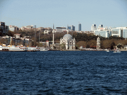 The Beyoglu district with the Dolmabahce Mosque (Bezm-i Alem Valide Sultan Mosque, Dolmabahce Camii) and boats in the Bosphorus strait, viewed from the Bosphorus ferry