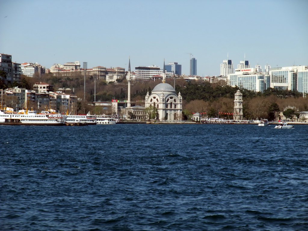 The Beyoglu district with the Dolmabahce Mosque (Bezm-i Alem Valide Sultan Mosque, Dolmabahce Camii) and boats in the Bosphorus strait, viewed from the Bosphorus ferry