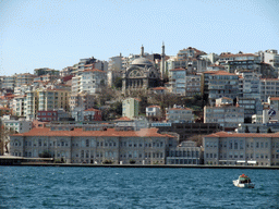 The Cihangir Mosque (Cihangir Camii) and surroundings, and a boat in the Bosphorus strait, viewed from the Bosphorus ferry